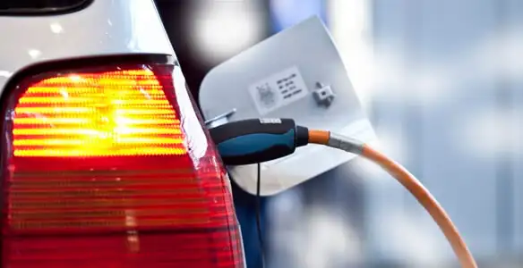 Electric car plugged into EV charger after professional installation in Buffalo, NY