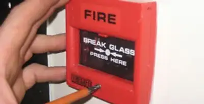 fire alarm installation service showing manual fire alarm pull station installed by licensed electricians in Buffalo, NY