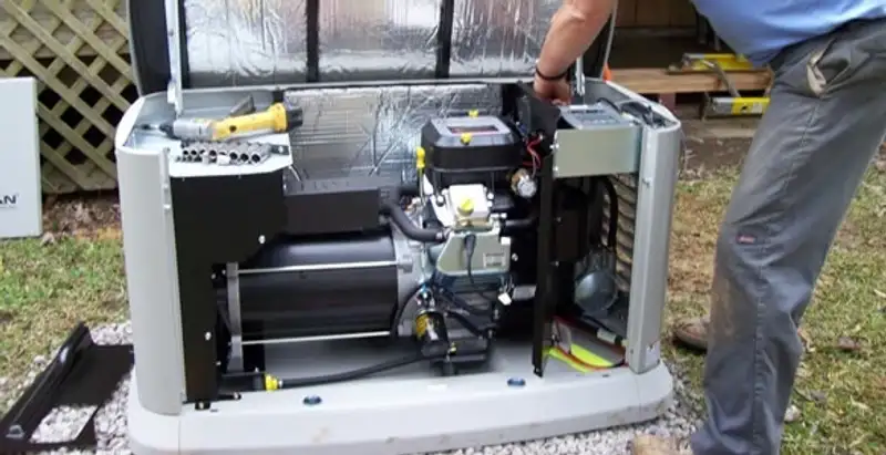 generator installation service showing technician connecting and configuring generator components in Buffalo, NY