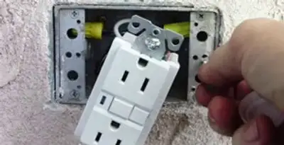 gfci circuits service showing installation of a ground fault circuit interrupter outlet by licensed electricians in Buffalo, NY