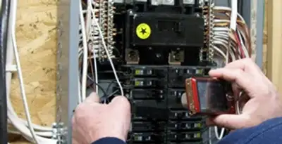 Home electrical inspection of circuit breaker panel by licensed electrician in Buffalo, NY