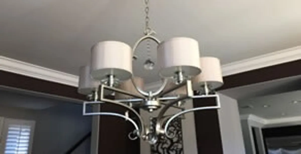 Modern chandelier installation with multiple light fixtures in Buffalo, NY