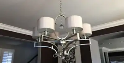 Modern chandelier installation with multiple light fixtures in Buffalo, NY