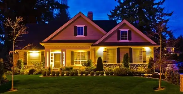 security light installation services illuminating a residential exterior at night in Buffalo, NY