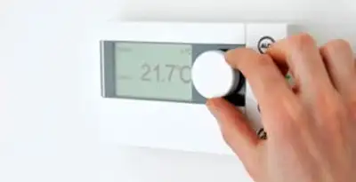 Thermostat installation service with professional adjusting temperature control in Buffalo, NY