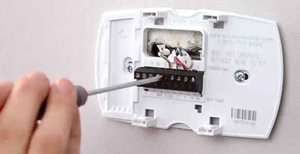 Thermostat installation service with proper wiring and secure wall mounting in Buffalo, NY
